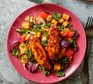 A serving of air fryer harissa sausage & veg traybake