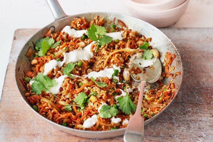 Carrot biryani Carrot biriyani in a pot with a spoon
