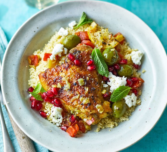 Chicken tagine recipes Bowl of chicken tagine with couscous and pomegranates