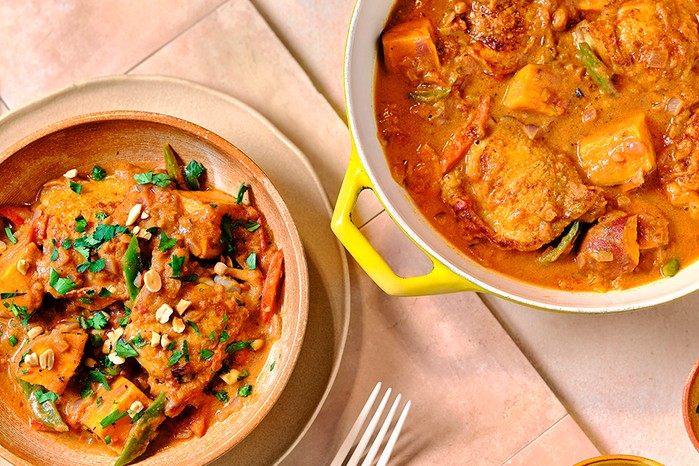 Chicken,-sweChicken, sweet potato & peanut stewet-potato-and-peanut-stew A casserole dish with chicken, sweet potato & peanut stew