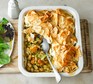 Creamy leek, pesto & squash pie in a serving dish