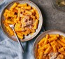 Creamy pumpkin pasta in two bowls
