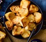 Crispy air fryer roasties Bowl of roast potatoes