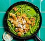 Crispy gnocchi with cavolo nero pesto, asparagus & peas Crispy gnocchi in a frying pan with cavolo nero pesto, asparagus & peas