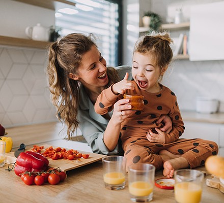 A mother and daughter enjoying food together