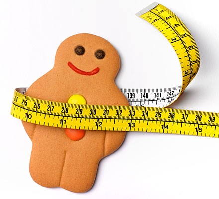 15 weight-loss myths busted A gingerbread person with a tape measure wrapped around the waist