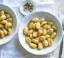 Gnocchi cacio e pepe served in bowls