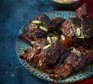 Slow-cooker gochujang short ribs with apple slaw Slow-cooker gochujang short ribs with apple slaw served on a plate