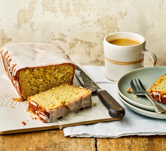 vegan courgette loaf cake with a slice on a plate and a slice just cut