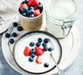 Slow cooker bio yogurt Slow cooker bio yogurt in a jar and a bowl served with berries