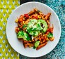 Low-calorie recipes Tomato penne with avocado on a white plate