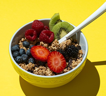 Colourful fruit and granola bowl