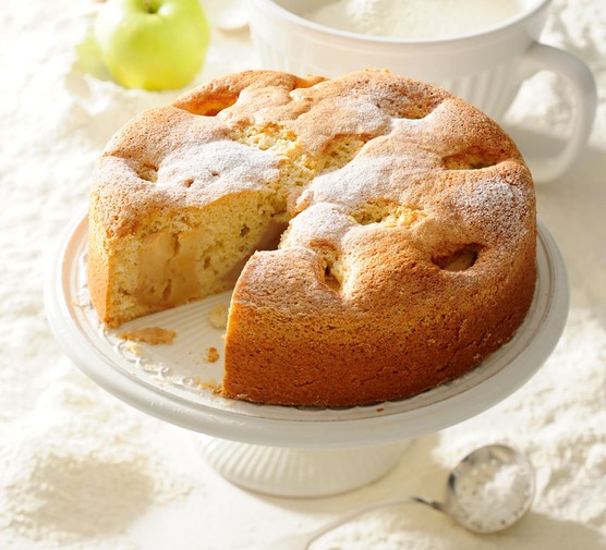 Polish baking recipes Polish apple cake on a stand, with slice taken out