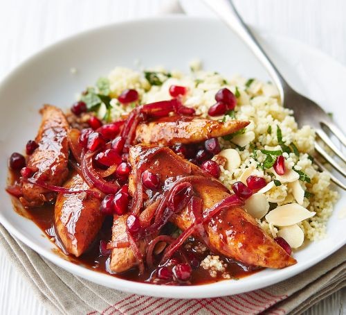 Quick chicken recipes Chicken pieces in pomegranate sauce with couscous in a bowl