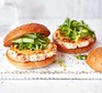 Two prawn & salmon burgers with green salad