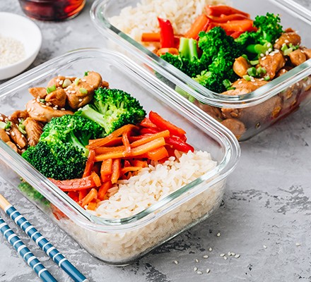 Chicken teriyaki stir fry meal prep lunch box containers with broccoli, rice and carrots
