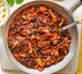 Pulled chicken & black bean chilli in a large pan