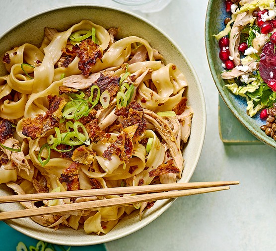 A bowl of quick & spicy chicken noodles with chopsticks