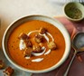 Roasted red pepper soup with crispy croutons A bowl of roasted red pepper soup with crispy croutons