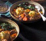Slow cooker beef stew with dumplings Two bowls of slow cooker beef stew with dumplings