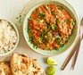 Slow cooker chicken tikka masala served with rice and naan bread