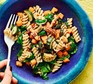 Squash & spinach fusilli with pecans A blue plate serving squash & spinach fusilli with pecans