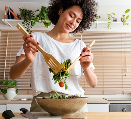 6 tips for success with the Healthy Diet Plan Woman making healthy salad